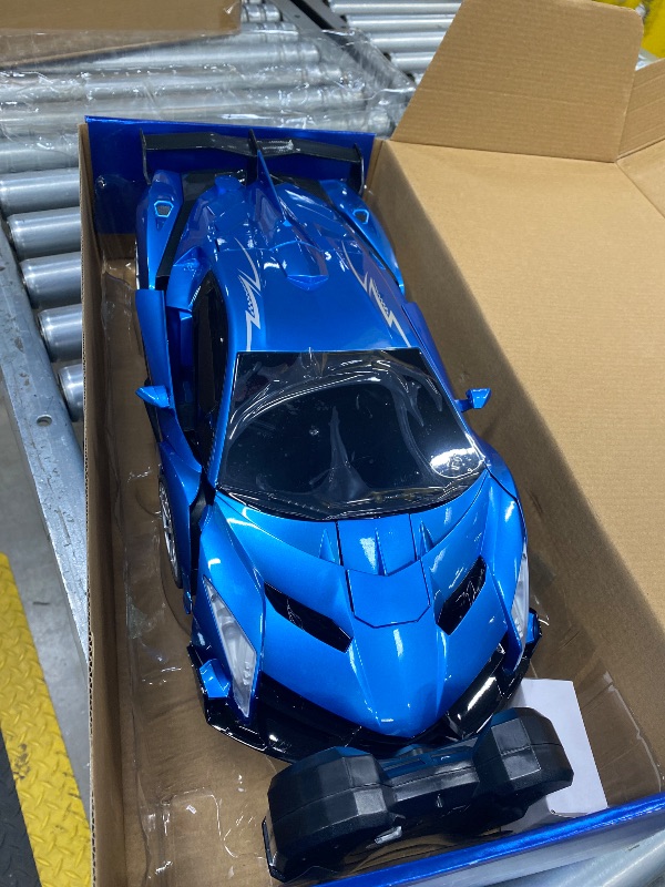 Photo 1 of ***DAMAGED -SELLING AS IS *** Veeniix V991 Transform Remote Control Car, 1:10 Big Size, 2 Rechargeable Batteries for 70Min, 2.4GHz Gesture Sensing, One-Key Deformation, Robot Toys Gifts for Boys and Girls (Blue)