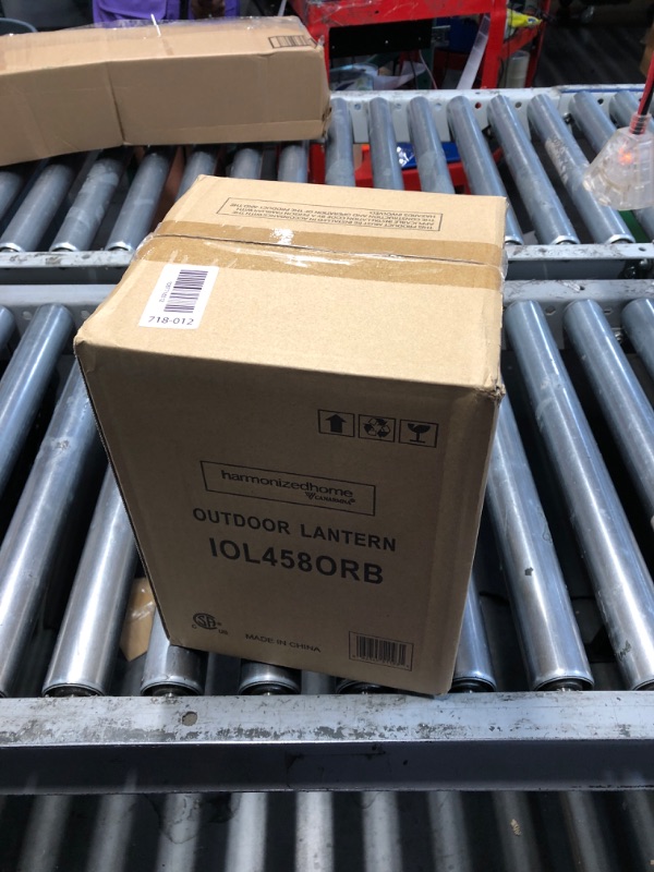 Photo 1 of ***FACTORY SEALED*** 

Korber Outdoor Lantern, Oil Rubbed Bronze Finish, Clear Glass Shade