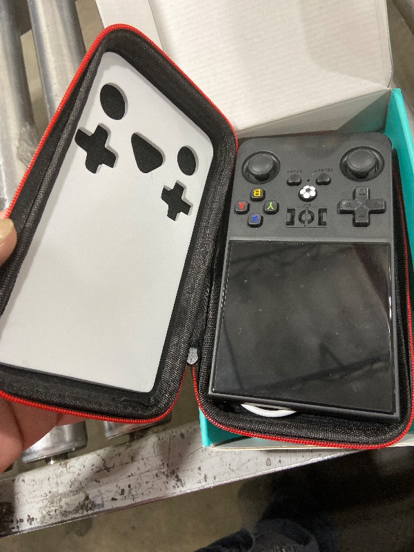 Photo 1 of ?R36MAX 4000mAh Portable Rechargeable Handheld Retro Game Console,Comfort Non-Slip Handheld Standing Retro Game Console with 64G TF Car,4.0-inch Screen,for Office,Black