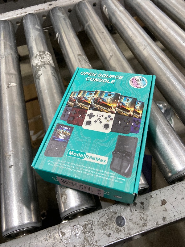 Photo 1 of ?R36MAX 4000mAh Portable Rechargeable Handheld Retro Game Console,Comfort Non-Slip Handheld Standing Retro Game Console with 64G TF Car,4.0-inch Screen,for Office,Black