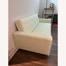 Photo 1 of CREME TUFTED COUCH FAUZ LEATHER