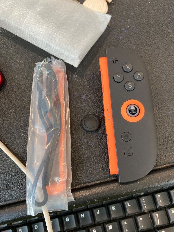 Photo 1 of ***MAJOR DAMAGE*** Nintendo Joy-Con™ 2 (R) Light Red