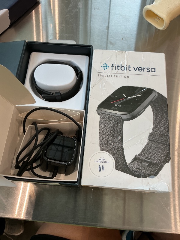 Photo 1 of *NON-FUNCTIONAL*
Fitbit Versa Special Edition Smart Watch, Charcoal Woven, One Size (S & L Bands Included)