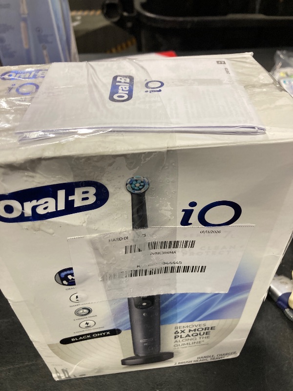 Photo 1 of Oral-B iO Deep Clean + Protect Rechargeable Electric Toothbrush, Black, iO Series 7, 2 Replacement Brush Heads, Charging Travel Case