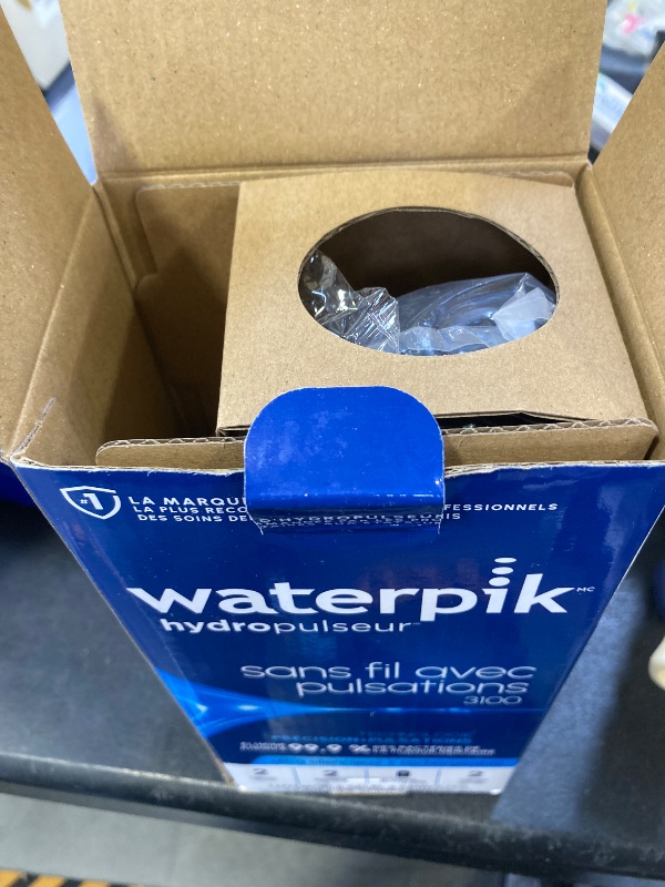 Photo 1 of Waterpik Cordless Pulse Rechargeable Portable Water Flosser for Teeth, Gums, Braces Care and Travel with 2 Flossing Tips, Waterproof for Shower, ADA Accepted, WF-20 Blue, Packaging and Tips May Vary