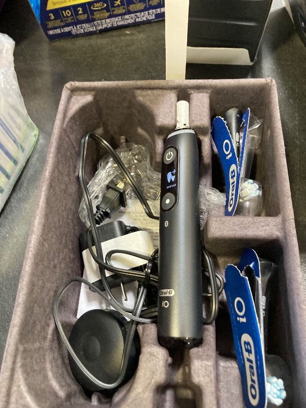 Photo 1 of Oral-B iO Deep Clean + Protect Rechargeable Electric Toothbrush, Black, iO Series 7, 2 Replacement Brush Heads, Charging Travel Case