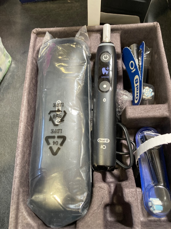 Photo 1 of Oral-B iO Deep Clean + Protect Rechargeable Electric Toothbrush, Black, iO Series 7, 2 Replacement Brush Heads, Charging Travel Case