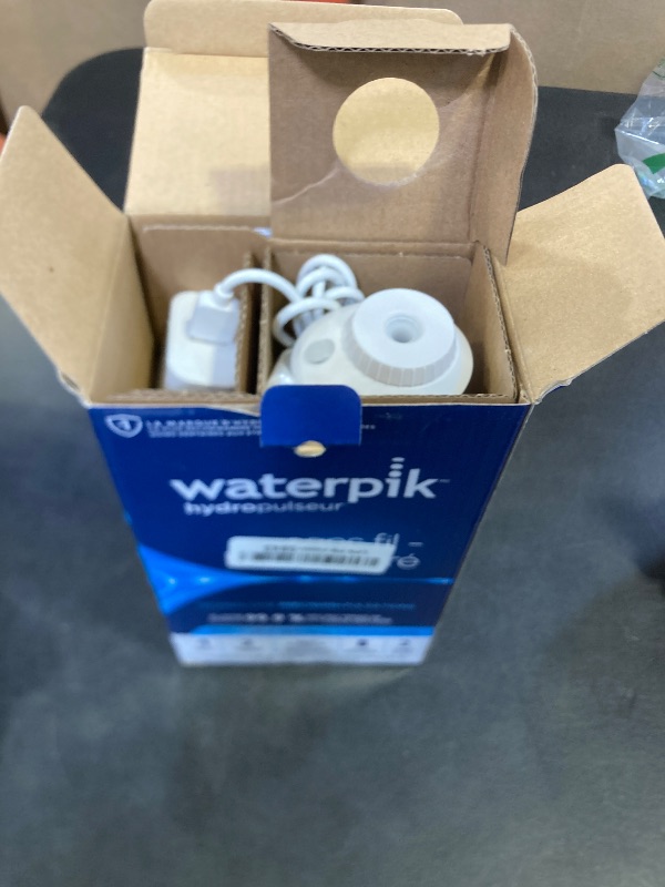 Photo 1 of Waterpik Cordless Pearl Rechargeable Portable Water Flosser for Teeth, Gums, Braces Care and Travel with 4 Flossing Tips - ADA Accepted, WF-13 White, Packaging May Vary