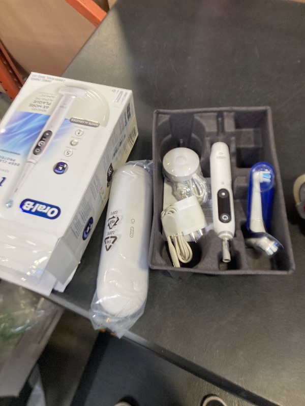 Photo 1 of Oral-B iO Deep Clean + Protect Rechargeable Electric Toothbrush, White, iO Series 7, 2 Replacement Brush Heads, Charging Travel Case