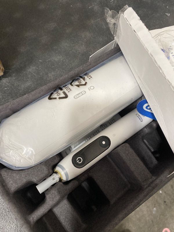 Photo 1 of Oral-B iO Deep Clean + Protect Rechargeable Electric Toothbrush, White, iO Series 7, 2 Replacement Brush Heads, Charging Travel Case