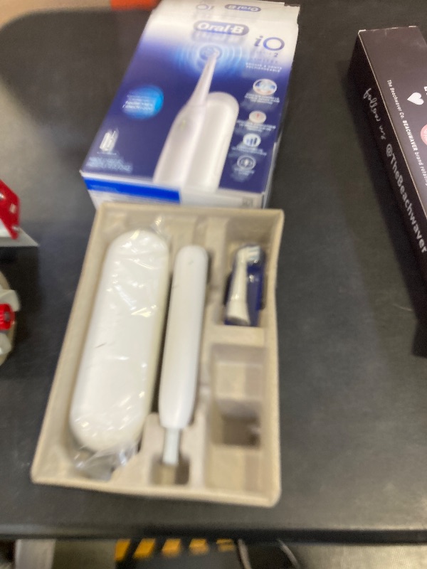 Photo 1 of Oral-B iO Simple Clean Rechargeable Electric Powered Toothbrush, Pure White with 1 Gentle Care Brush Head and 1 White Travel Case - Automatic Pressure Sensor to Protect Gums - 3 Modes -2 Min Timer