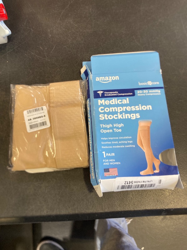 Photo 1 of Amazon Basic Care Medical Compression Stockings for Circulation, Varicose Veins, Edema, Swelling, 20-30 mmHg Support, Women & Men Thigh Length Hose, Open Toe, Beige, Small (Previously NuVein)