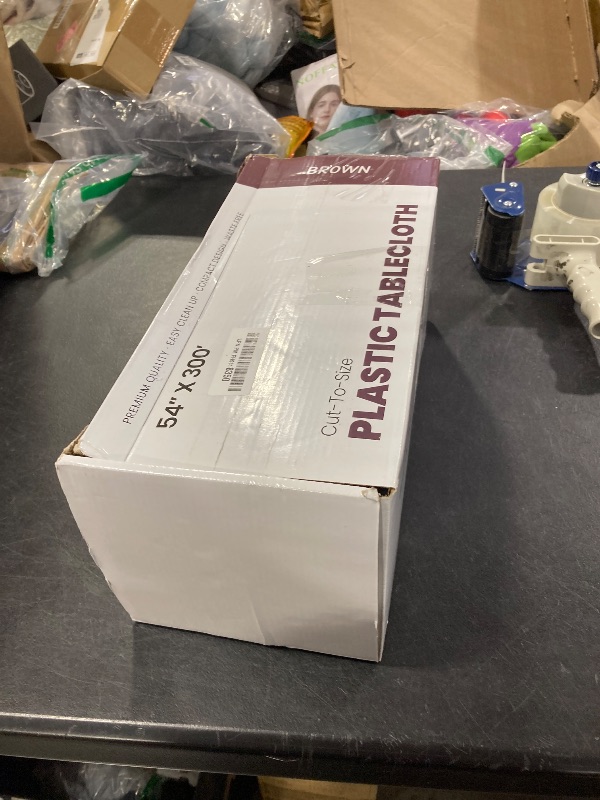 Photo 1 of Party Solids 54 Inch X 300 Feet Brown Plastic Table Cover Roll in A Cut - to - Size Box with Convenient Slide Cutter. Cuts Up to 36 Rectangle 8 Feet Plastic Disposable Tablecloths