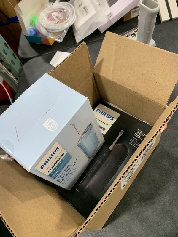 Photo 1 of Philips Sonicare Compact Flosser 1000, Blue, ProtectiveClean 5300 Rechargeable Electric Toothbrush and 2PK Compact Nozzle Bundle