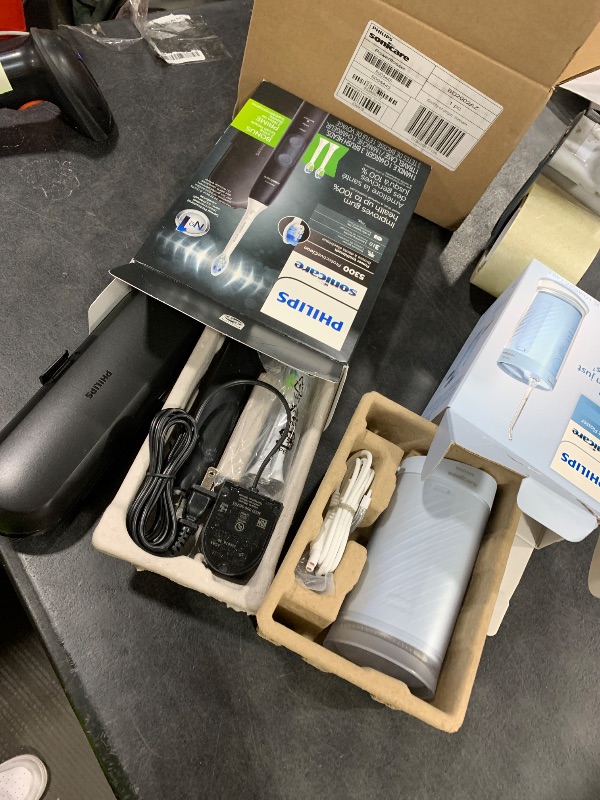Photo 1 of Philips Sonicare Compact Flosser 1000, Blue, ProtectiveClean 5300 Rechargeable Electric Toothbrush and 2PK Compact Nozzle Bundle