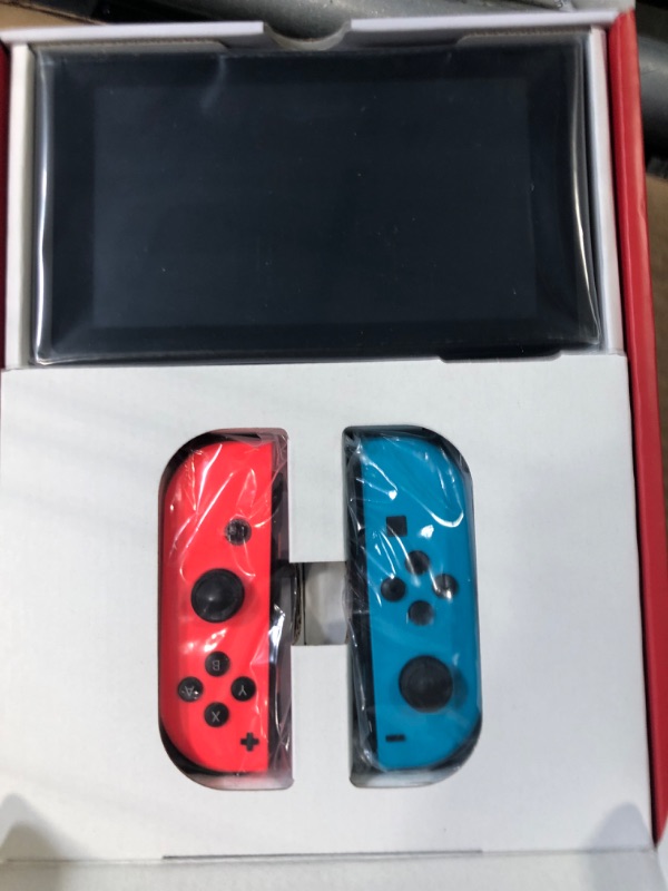 Photo 1 of **NON-FUNCTIONAL**
Nintendo Switch with Neon Blue and Neon Red Joy-Con - Handheld Gaming Console