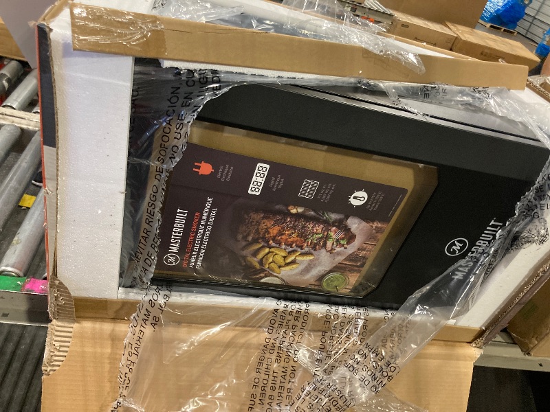 Photo 1 of **new ** Masterbuilt® 30-inch Digital Electric Vertical BBQ Smoker with Leg Kit, Side Wood Chip Loader and 710 Cooking Square Inches in Black, Model MB20070421