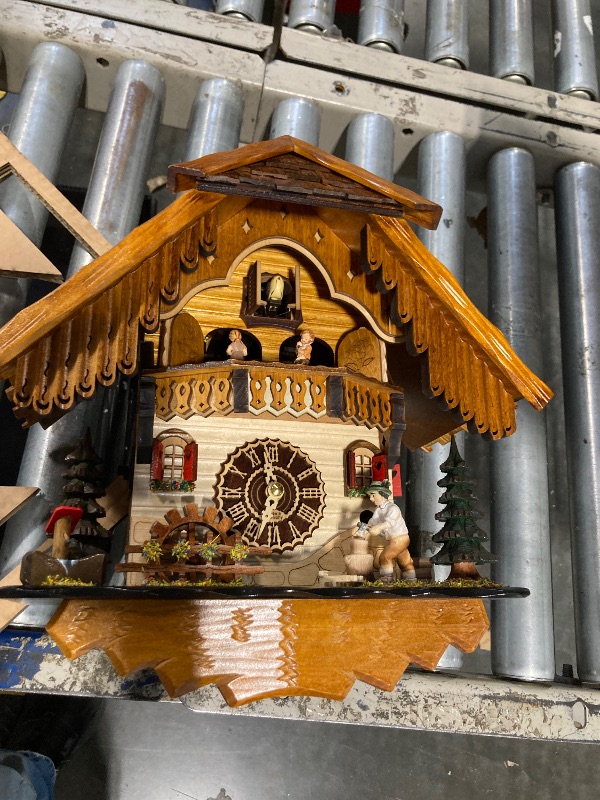 View 2 of ***IT NEEDS TO BE REPAIRED***Trenkle Quartz Cuckoo Clock Black Forest House with Moving Wood Chopper and Mill Wheel, with Music TU 498 QMT HZZG