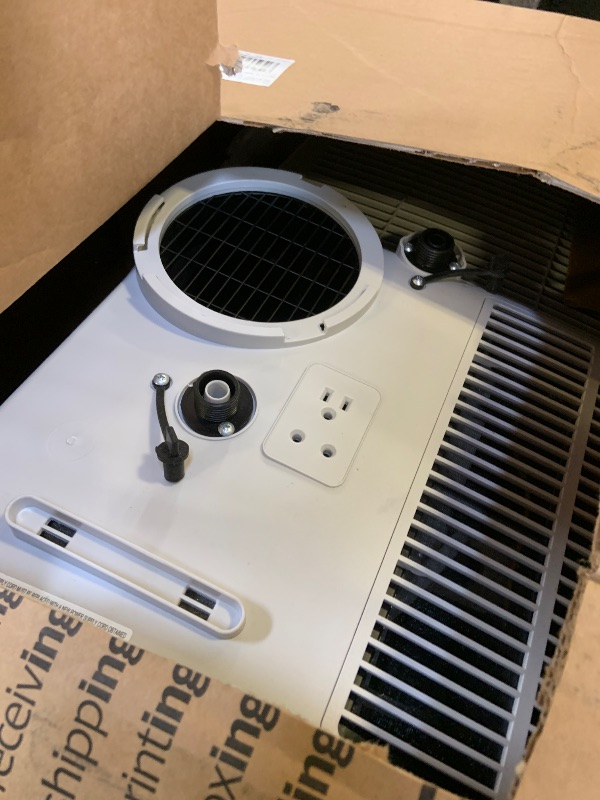 Photo 1 of Amazon Basics 4-In-1 Portable Air Conditioner, 13500 BTU (ASHRAE), Cools Up to 550 Sqf, Portable AC with Cool/Heat/Dry (Dehumidifier)/Fan-Only Functions, Auto Mode, Sleep Mode, Timer, White