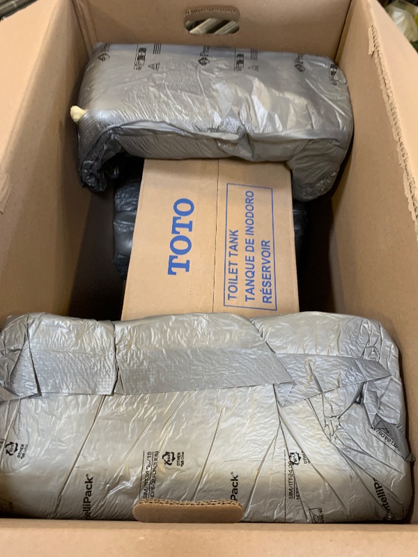 Photo 1 of TOTO Drake Transitional Two-Piece Elongated 1.28 GPF Universal Height TORNADO FLUSH Toilet with CEFIONTECT, Cotton White - CST786CEFG#01