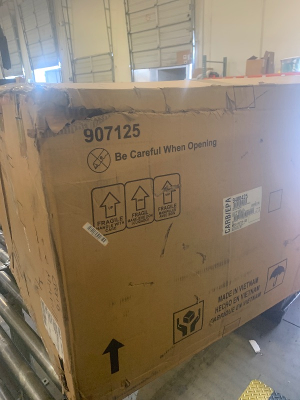 Photo 1 of Signature Design by Ashley Navi Modern Recliner with Rocking Motion, Dark Brown