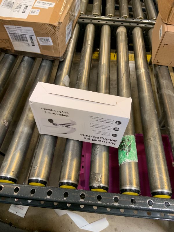 Photo 1 of Handheld Sewing Machine,Two dear,Mini sewing machine,Easy to Use and Fast Stitch Suitable for Clothes,Fabrics, DIY Home Travel Electric Handheld Sewing Machine for Beginners.White