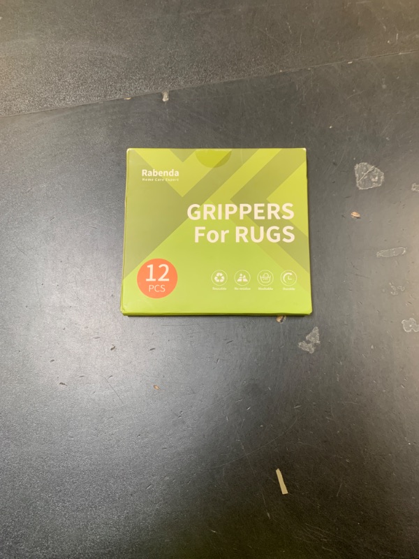 Photo 1 of Rabenda 12 Pcs Rug Tape, Non Slip Rug Pads Grippers for Hardwood Floors and Tiles, Reusable Carpet Tape for Area Rugs, Double-Sided Adhesive Rug Stickers Keep Corners Flat (Black)