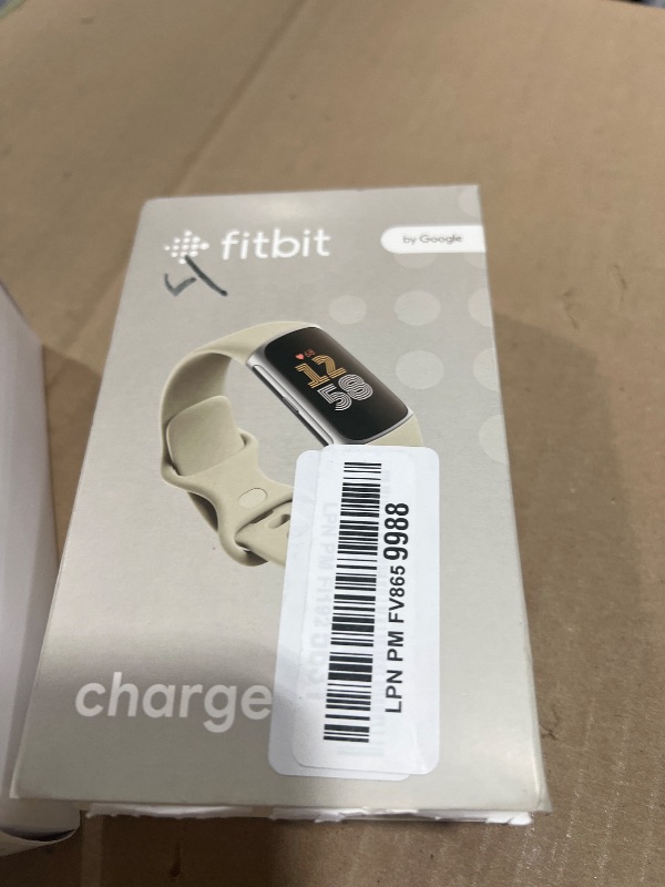 Photo 1 of Fitbit Charge 6 Fitness Tracker with Google apps, Heart Rate on Exercise Equipment, 6-Months Premium Membership Included, GPS, Health Tools and More, Porcelain/Silver, One Size (S & L Bands Included)