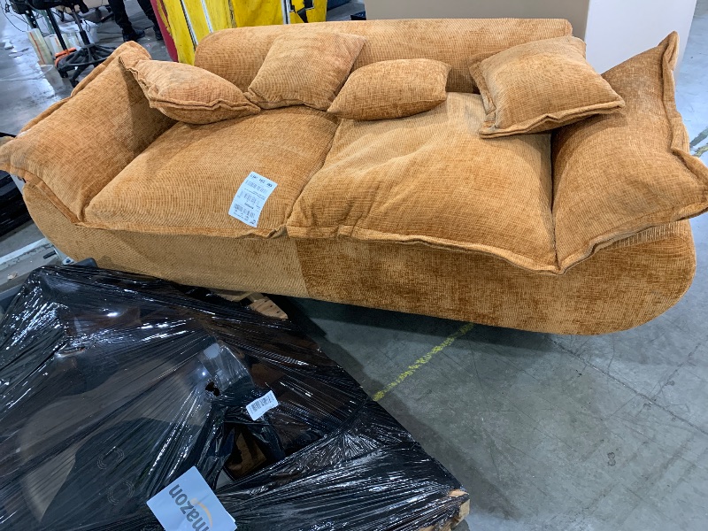 Photo 1 of Camel-colored modular sectional sofa with large, plush cushions