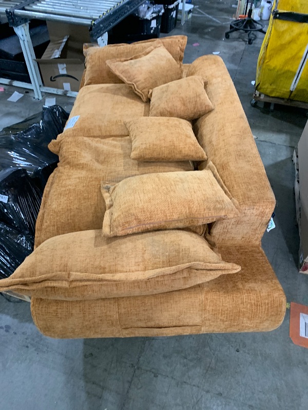 Photo 1 of Camel-colored modular sectional sofa with large, plush cushions