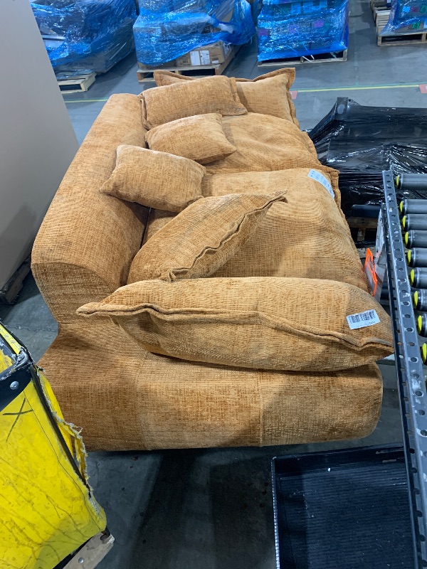 Photo 1 of Camel-colored modular sectional sofa with large, plush cushions