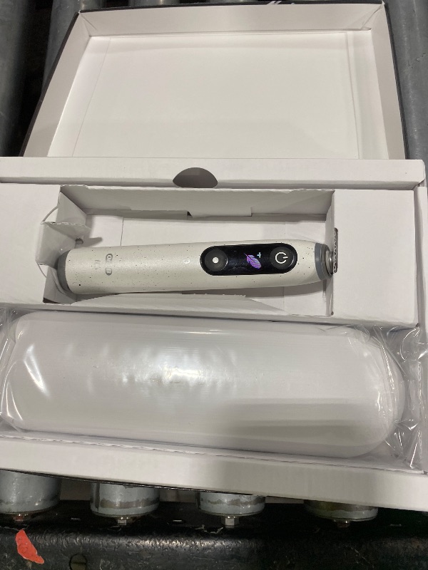 Photo 1 of Oral-B iO Series 10 Rechargeable Electric Toothbrush with Visible Pressure Sensor to Protect Gums, 2 Min Timer, 7 Cleaning Settings, 4 Replacement Toothbrush Heads, and Charging Travel Case, White