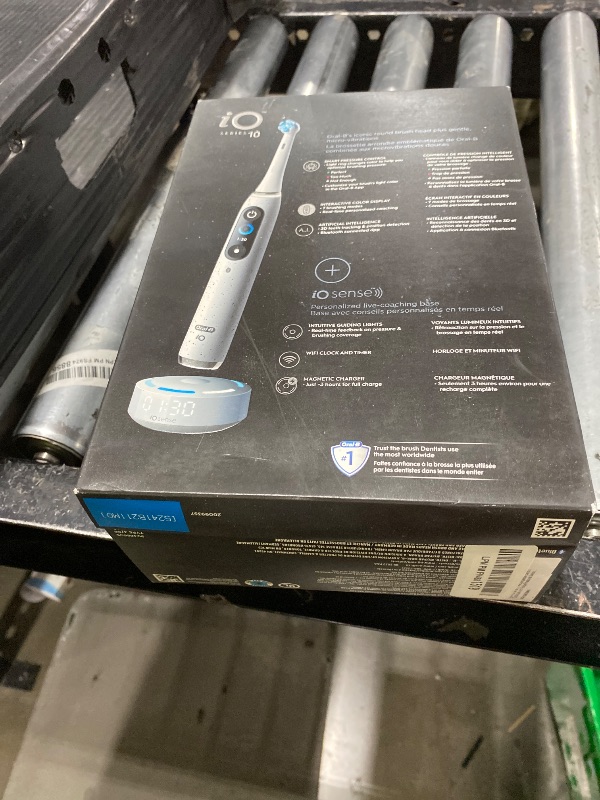 Photo 1 of Oral-B iO Series 10 Rechargeable Electric Toothbrush with Visible Pressure Sensor to Protect Gums, 2 Min Timer, 7 Cleaning Settings, 4 Replacement Toothbrush Heads, and Charging Travel Case, White