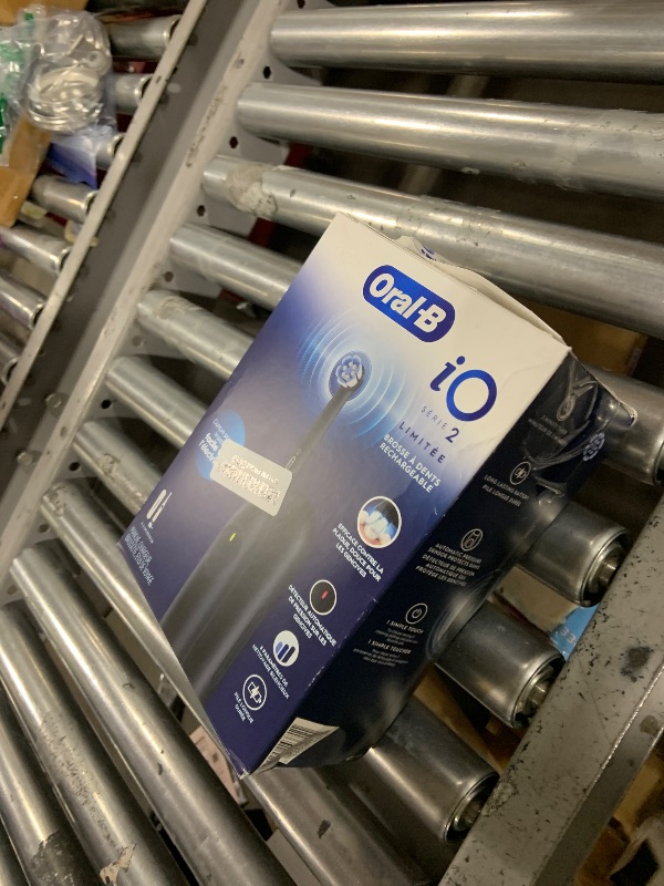 Photo 1 of Oral-B iO Simple Clean Rechargeable Electric Powered Toothbrush, Night Black with 1 Gentle Care Brush Head and 1 Black Travel Case - Automatic Pressure Sensor to Protect Gums - 3 Modes - 2 Min Timer