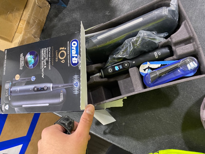 Photo 1 of Oral-B Rechargeable Electric Toothbrush, iO9 Limited Ultimate Clean, 7 Cleaning Modes, Interactive Display, iSense Charger, Charging Travel Case, Visible Pressure Sensor, 3 Brush Heads, Black
