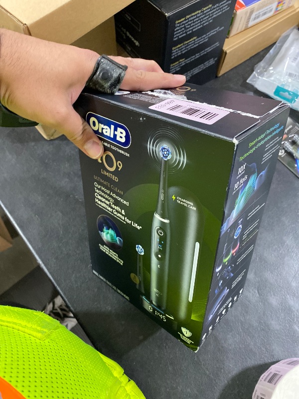 Photo 1 of Oral-B Rechargeable Electric Toothbrush, iO9 Limited Ultimate Clean, 7 Cleaning Modes, Interactive Display, iSense Charger, Charging Travel Case, Visible Pressure Sensor, 3 Brush Heads, Black