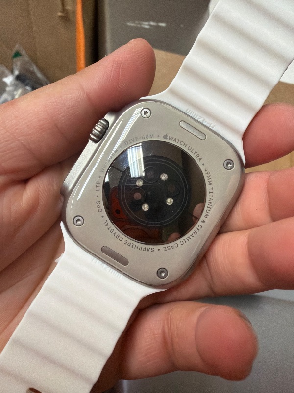 Photo 1 of *LOCKED*Apple Watch Ultra 2 [GPS + Cellular 49mm] Smartwatch with Rugged Titanium Case & White Ocean Band. Fitness Tracker, Precision GPS, Action Button, Extra-Long Battery Life, Bright Retina Display