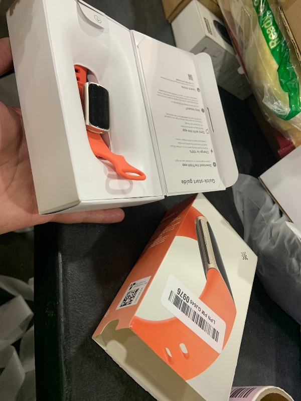 Photo 1 of Google Fitbit Charge 6 - Fitness Tracker - Gold/Coral