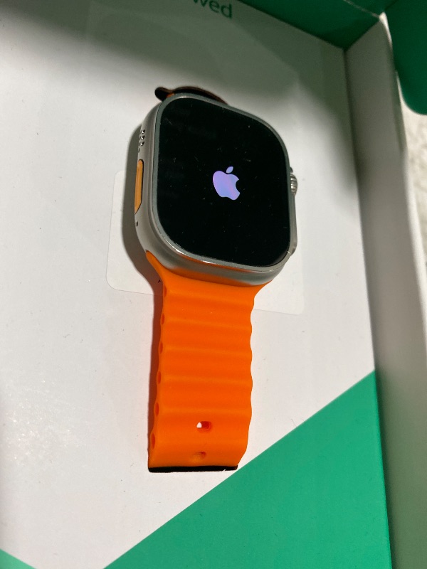 Photo 1 of Apple Watch Ultra 2 [GPS + Cellular, 49mm] - Rugged Titanium Case with Orange Ocean Band, One Size (Renewed Premium)