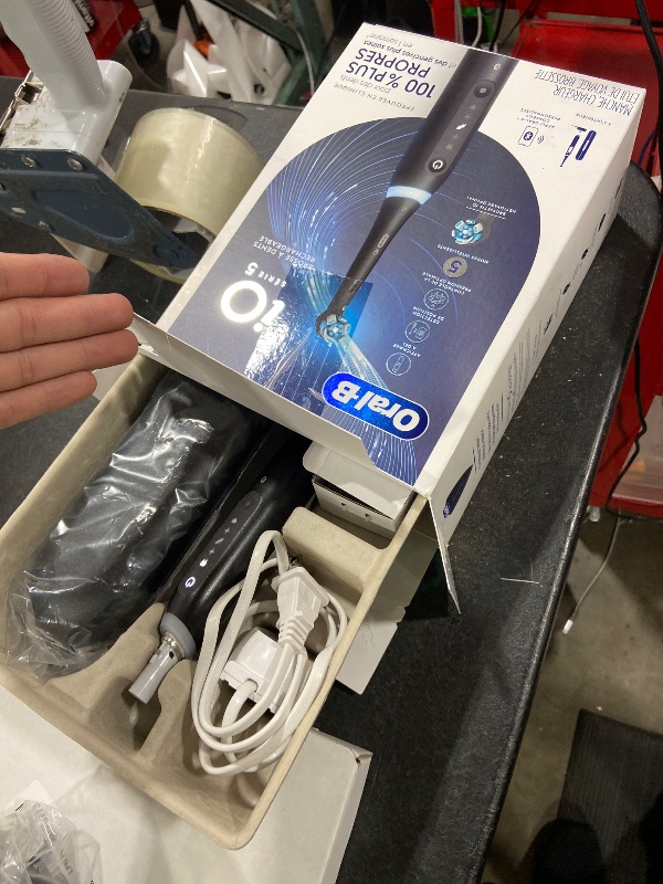 Photo 1 of Oral-B Rechargeable Electric Toothbrush, iO5 Customizable Clean, 5 Cleaning Modes, Visual Pressure Sensor to Protect Gums, Travel Case, Black