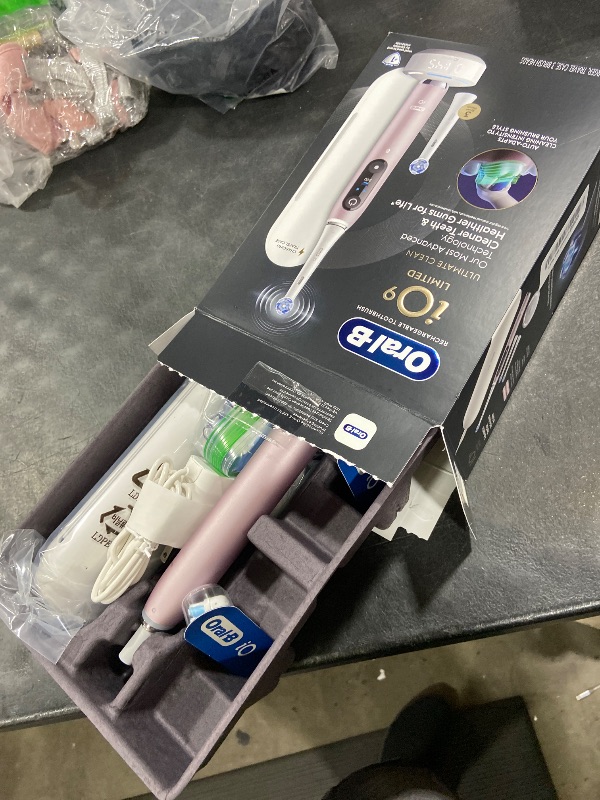 Photo 1 of Oral-B Rechargeable Electric Toothbrush, iO9 Limited Ultimate Clean, 7 Cleaning Modes, Interactive Display, iSense Charger, Charging Travel Case, Visible Pressure Sensor, 3 Brush Heads, Rose Quartz