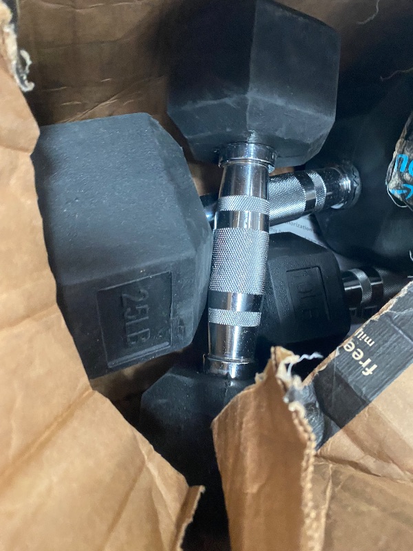 Photo 1 of 1-25 Pound and 2- 10 Pound Dumbells