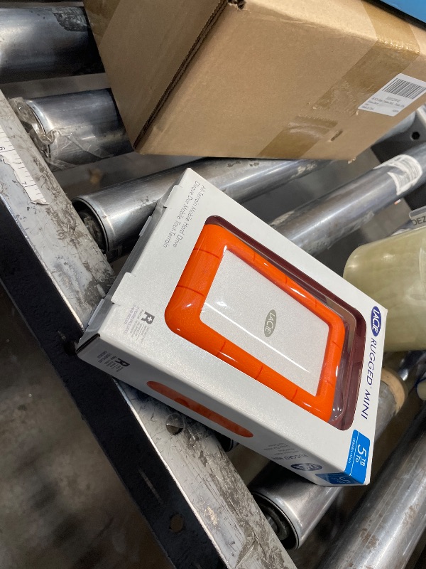 Photo 1 of LaCie Rugged Mini, 5T,B USB 3.0 Portable 2.5 inch External Hard Drive for PC and Mac, Orange/Grey, with Rescue Services (STJJ5000400)