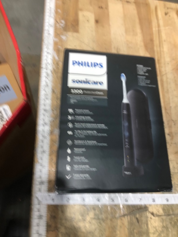 Photo 1 of **FACTORY SEALED** Philips Sonicare ProtectiveClean 5300 Rechargeable Electric Toothbrush, with Pressure Sensor, 3 Cleaning Modes, SmarTimer and QuadPacer, with 2 Bonus Brush Heads, Travel Case, Black, Model HX6423/34