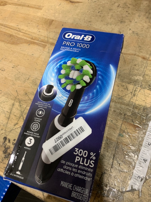 Photo 1 of **FACTORY SEALED** Oral-B Pro 1000 Rechargeable Electric Toothbrush, Black