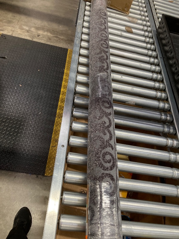 Photo 1 of 
dark grey rug with flowers on the boarder