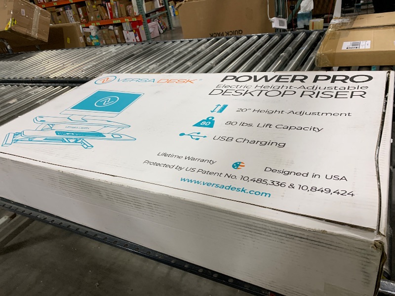 Photo 1 of VERSADESK® PowerPro™ Electric Standing Desk Converter - Height Adjustable Desk Riser with Keyboard Tray - Holds 80 lbs - Built-in USB Charging Port - Ergonomic Sit Stand Workstation | White (36 inch)