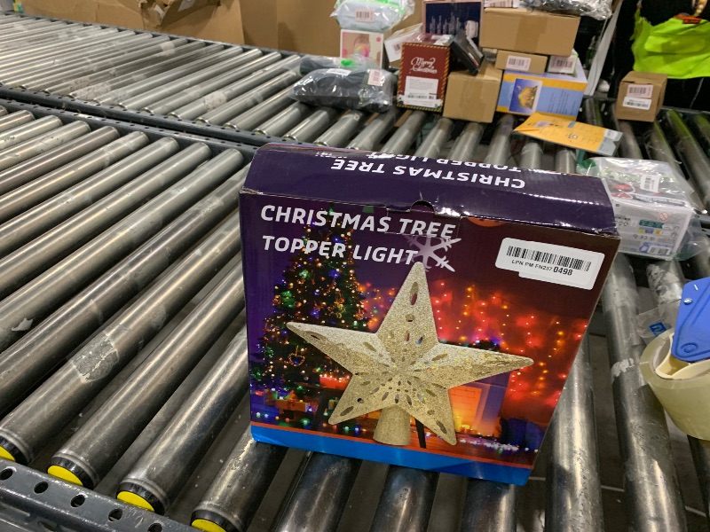 Photo 1 of 10" Christmas Tree Topper Projector with 6 Projection Modes, Lighted Christmas Tree Topper Star Built-in LED Rotation Light, 3D Glitter Dynamic TreeTop for Xmas Holiday Party Decorations Gift (Silver)