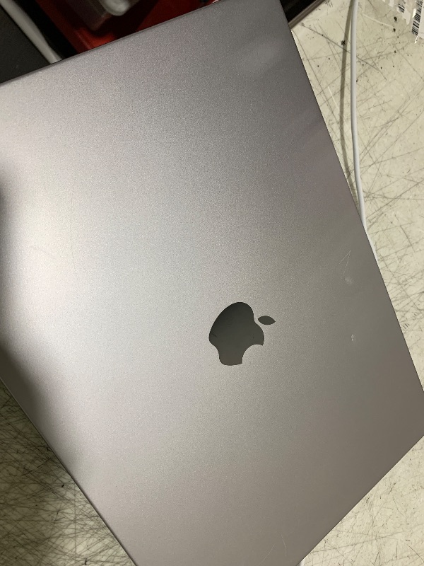 Photo 1 of Apple MacBook Pro Late 2021 with Apple M1 Pro chip (16-inch, 16GB RAM, 512GB SSD) Space Gray (Renewed)