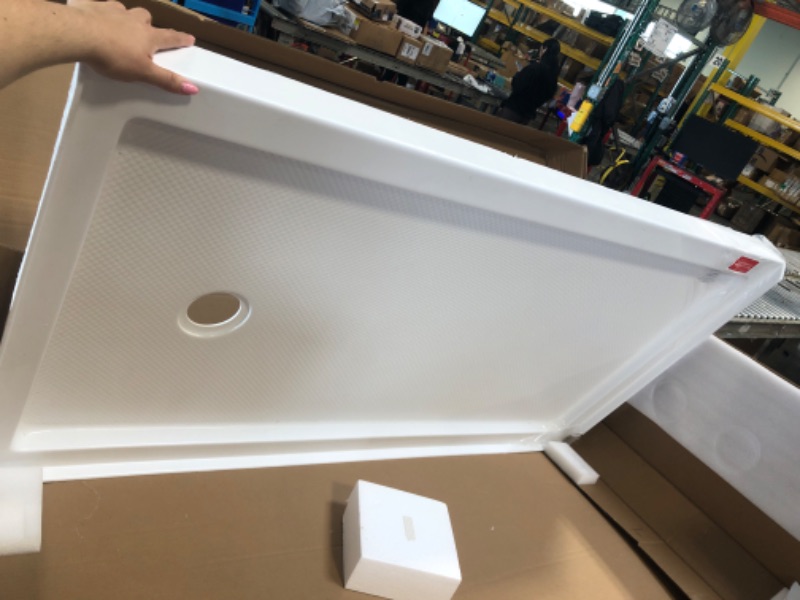 Photo 1 of **** SOME OF THE EDGES ARE BROKEN, PLEASE SEE PICTURES****
DreamLine SlimLine 32 in. D x 60 in. W x 2 3/4 in. H Right Drain Single Threshold Shower Base in White, DLT-1132602